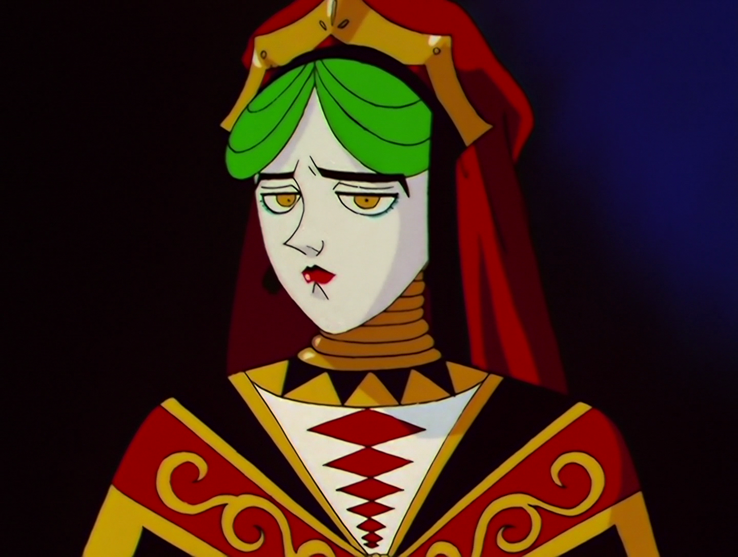 U-Ikasaman, a Daimon from Sailor Moon episode 118. She has pale white skin, bright green hair and extremely angular features. She’s also dressed like a queen from a playing card, wearing a robe and crown of red, gold, black and white. She has a very odd expression, like she’s desperate to burst out laughing and trying to stifle it.